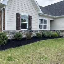 Black mulch beds at a light home